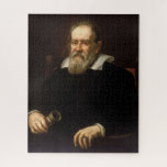 Galileo Galilei: Father of Science & Astronomy Jigsaw Puzzle<br><div class="desc">Justus Sustermans, a Flemish artist, captured Galileo Galilei in oil paint around 1636. The portrait depicts the renowned scientist in his later years. Seated in a chair, his white beard and dark clothing convey a sense of age and experience. A telescope, the instrument that revolutionized his life's work, rests prominently...</div>