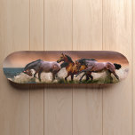 Galloping Horses in Surf Skateboard Deck<br><div class="desc">Ride the edge with this bold surf-meets-stallion design that turns every deck into a statement. Galloping horses charge through ocean waves in a graphic that captures movement, power, and freedom all at once. Whether you're carving pavement or hanging it as wall art, this piece speaks to your wild side. Clean...</div>