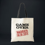 Game Over funny tote bag with wedding date stamp<br><div class="desc">Game Over funny tote bag with wedding date stamp. Fun wedding day gift idea for newlywed couple and honeymooners. Personalize this present for bride and groom. Vintage style design with red rubber stamp marking date of marriage. Cool party favor gift for the bachelor, husband and wife, guests, bridesmaids, crew, entourage...</div>