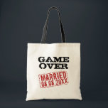 Game Over funny tote bag with wedding date stamp<br><div class="desc">Game Over funny tote bag with wedding date stamp. Fun wedding day gift idea for newlywed couple and honeymooners. Personalize this present for bride and groom. Vintage style design with red rubber stamp marking date of marriage. Cool party favor gift for the bachelor, husband and wife, guests, bridesmaids, crew, entourage...</div>