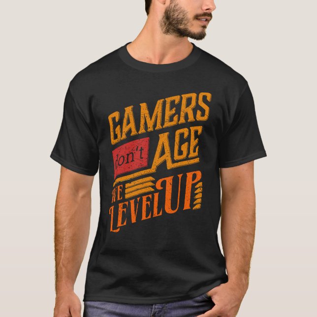 Gamers Don't Age We Level Up Funny Pun Arcade Game T-Shirt (Front)
