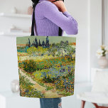 Garden at Arles | Vincent Van Gogh Tote Bag<br><div class="desc">Garden at Arles (1888) by Dutch post-impressionist artist Vincent Van Gogh. Original artwork is an oil on canvas depicting a lush landscape of colorful flowers. 

Use the design tools to add custom text or personalize the image.</div>