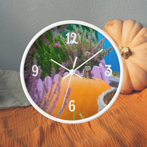 Garden still life with an orange pumpkin clock