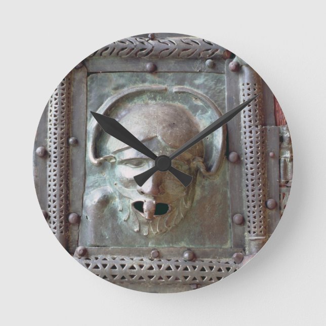 Gargoyle panel from the left door of the portal, 1 round clock (Front)