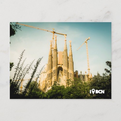 Gaudis Sagrada Familia with catalonias flag Postcard