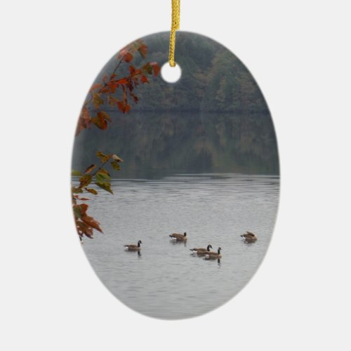 Geese swimming in Autumn Lake Arrowhead Ceramic Ornament