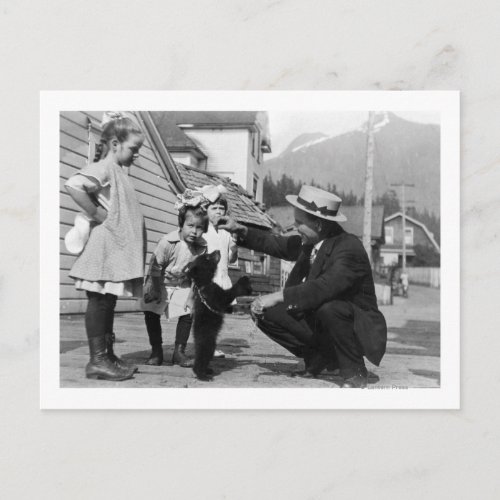 Gentleman and Kids Playing with Bear Cub On Leas Postcard