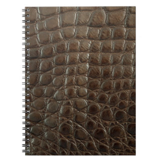 Genuine brown alligator leather, close up to show notebook