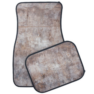 Genuine vintage washouts on the wooden surfaceaged car floor mat