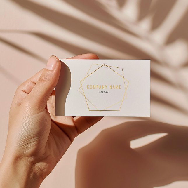Geometric gold effect business card (Modern business card with luxury gold effect geometric pentagon and elegant script.)