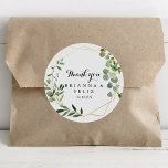 Geometric Gold Tropical Thank You Wedding Favor Classic Round Sticker<br><div class="desc">This geometric gold tropical thank you wedding favor classic round sticker is perfect for a simple wedding. The design features hand-painted beautiful green leaves, adorning a gold geometric frame. Make the sticker labels your own by including your names, the event (if applicable), and the date. These stickers can compliment a...</div>