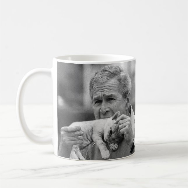 George W Bush Eating A Kitten Coffee Mug (Left)