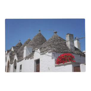 Geranium flowers and trulli houses in Alberobello Placemat