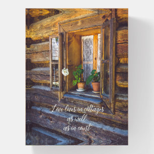 Geranium flowers on the window paperweight