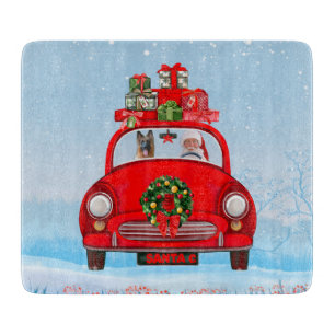 German Shepherd Dog In Car With Santa Claus Cutting Board