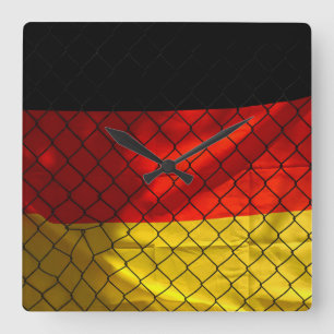 Germany Flag behind Chain Link Fence Square Wall Clock