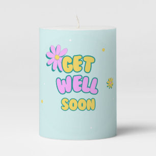 Get well soon bold text with flowers on blue pillar candle