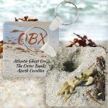 Ghost Crab OBX North Carolina Photographic Keychain<br><div class="desc">This photographic OBX beach keychain features an Atlantic Ghost Crab and his burrow in the beach sand. The Atlantic Ghost Crab can be found all along the Atlantic coast. As is, it is a travel souvenir of The Outer Banks North Carolina or the text may be customized with your beach's...</div>