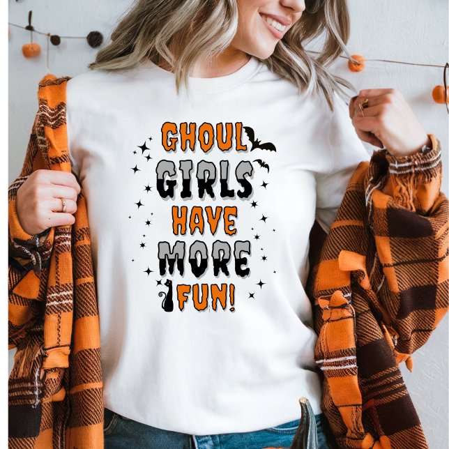 Ghoul Girls Have More Fun Modern Halloween Sweatshirt (Women in a Ghoul Girls Have More Fun Halloween sweater and an orange plaid top. )