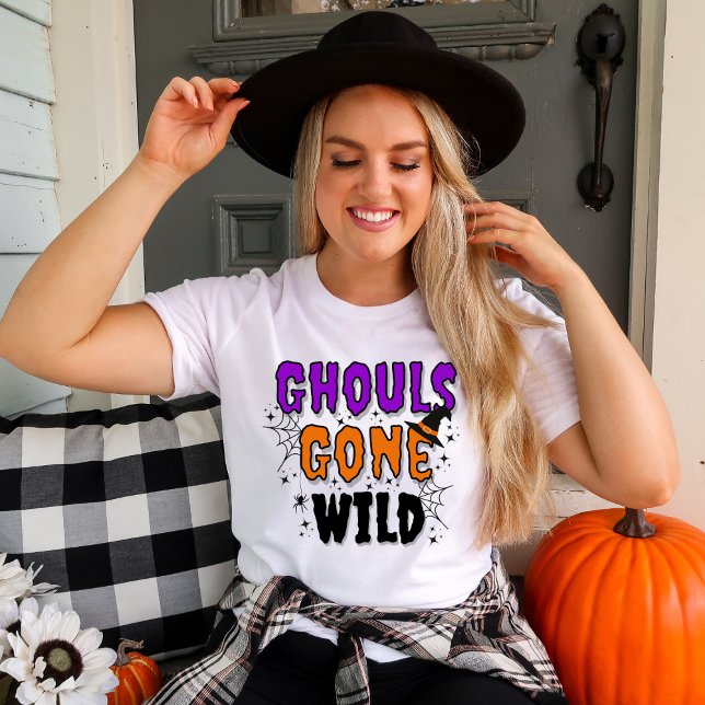 Ghouls Gone Wild Modern Halloween T-Shirt (Women in a white t-shirt with Ghouls Gone Wild Halloween topography with fall decor.)