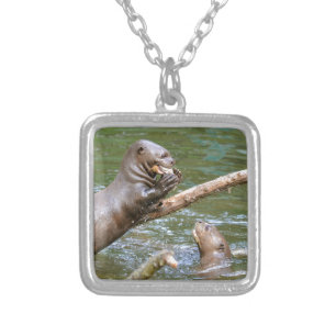 Giant otter eating a fish silver plated necklace