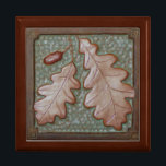 Gift Box with Oak Leaf Tile<br><div class="desc">The stunning gift box is made of golden oak, with a hinged top. It features a craftsman-style tile with an oakleaf in green and copper. Size: Large 7.125" Square w/6" Tile Hold your valuables in this beautiful keepsake box. Made of lacquered wood, the jewelry box comes in golden oak, ebony...</div>