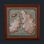 Gift Box with Oak Leaf Tile<br><div class="desc">The stunning gift box is made of golden oak, with a hinged top. It features a craftsman-style tile with an oakleaf in green and copper. Size: Large 7.125" Square w/6" Tile Hold your valuables in this beautiful keepsake box. Made of lacquered wood, the jewelry box comes in golden oak, ebony...</div>