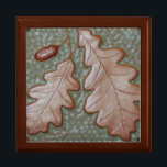 Gift box with oak leaf tile in green and copper<br><div class="desc">This stunning keepsake box makes a perfect gift. It features Oak Leaf tile in green and metallic copper. Size: Large 7.125" Square w/6" Tile Hold your valuables in this beautiful keepsake box. Made of lacquered wood, the jewelry box comes in golden oak, ebony black, emerald green, and red mahogany. Soft...</div>