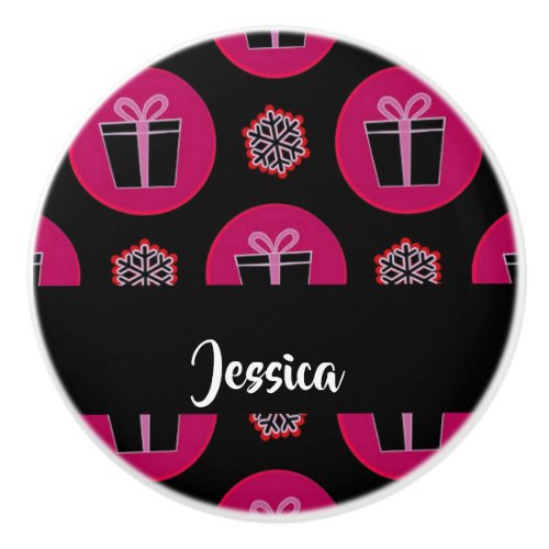 Gift boxes and snowflakes on black ceramic knob