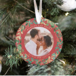 Gilded Greenery Red | Married and Merry Two Photo Ornament<br><div class="desc">This gorgeous newlyweds holiday keepsake ornament feature a lush, festive wreath of gold leaves, Christmas greenery, and red holly berries on a modern red background. Your personal wedding photo goes in the center along with the words "Married and Merry", and there is even a spot for your name. A second...</div>