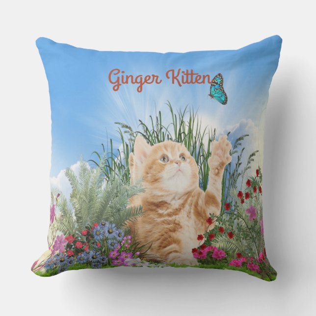 Ginger kitten playing with a butterfly outdoor pillow (Front)