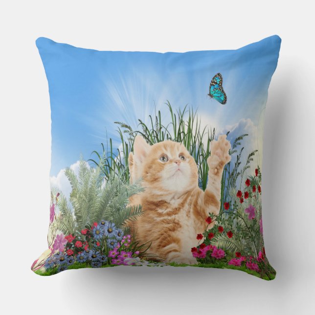 Ginger kitten playing with a butterfly throw pillow (Front)