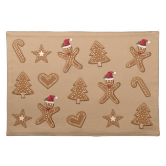 Gingerbread Christmas Cookie Shapes On Brown Cloth Placemat