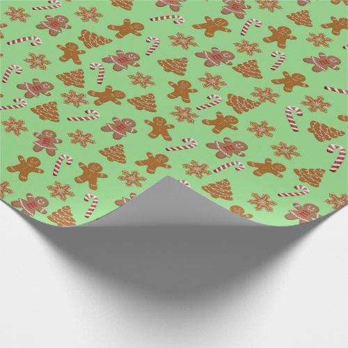 gingerbread cookies and candy canes on green wrapping paper