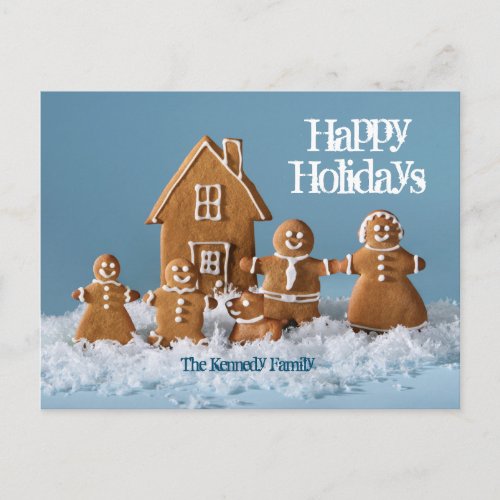 Gingerbread family in front of gingerbread house holiday postcard
