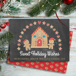 Gingerbread House Sweet Wishes Chalkboard Festive Holiday Card<br><div class="desc">“Sweet Holiday Wishes”. A cute, whimsical gingerbread house, gingerbread girl and boy, stars, hearts and candies, along with playful script typography, overlay a dark charcoal gray chalkboard background and help you usher in the holiday party season. A peppermint candy pattern over a red background adorns the back. Celebrate with family...</div>