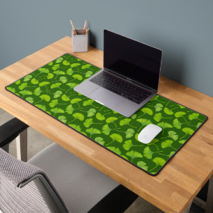 Ginkgo pattern on dark green desk mat