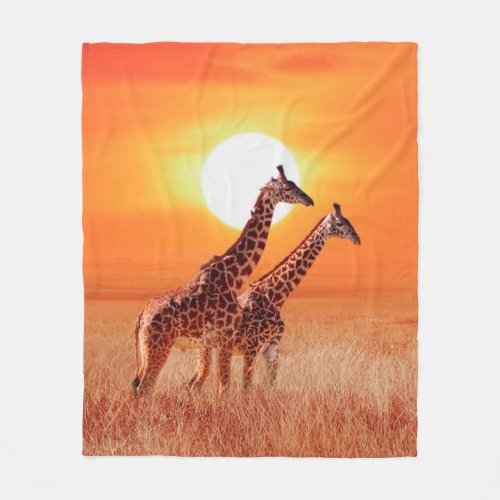 Giraffe in the African savanna against the backdro Fleece Blanket