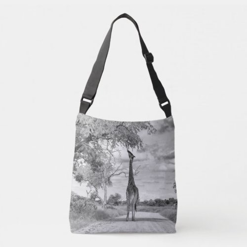 Giraffe on the road crossbody bag