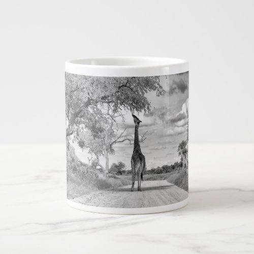 Giraffe on the road giant coffee mug