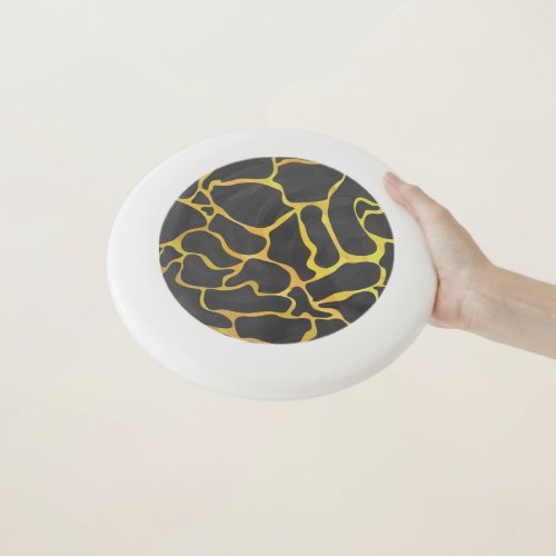 Giraffe pattern with black and yellow Wham_O frisbee