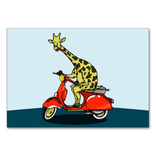 Giraffe riding a red scooter table number