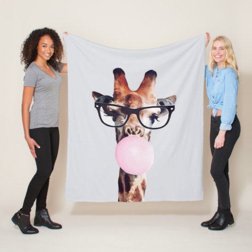 GIRAFFE WEARING GLASSES BLOWING A PINK BUBBLEGUM FLEECE BLANKET