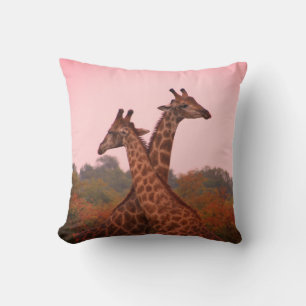 Giraffe with pink sky and mopani trees throw pillow