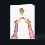 Giraffes kissing under mistletoe Christmas card<br><div class="desc">Make someone feel all warm and fuzzy this Christmas with this cute seasonal card featuring two giraffes kissing under the mistletoe,  both wearing festive knitwear 🦒</div>