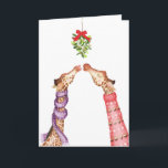 Giraffes kissing under mistletoe Christmas card<br><div class="desc">Make someone feel all warm and fuzzy this Christmas with this cute seasonal card featuring two giraffes kissing under the mistletoe,  both wearing festive knitwear 🦒</div>