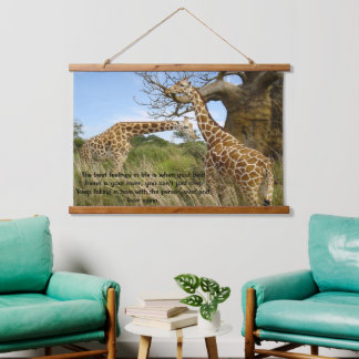 Giraffes out in the field by some trees poster hanging tapestry