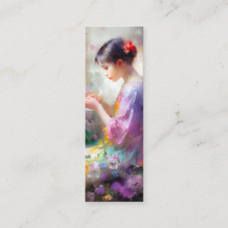 Girl admiring a flower in her hands mini business card