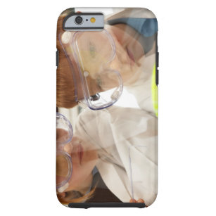 Girl and boy (11-13) looking at petri dish, view tough iPhone 6 case