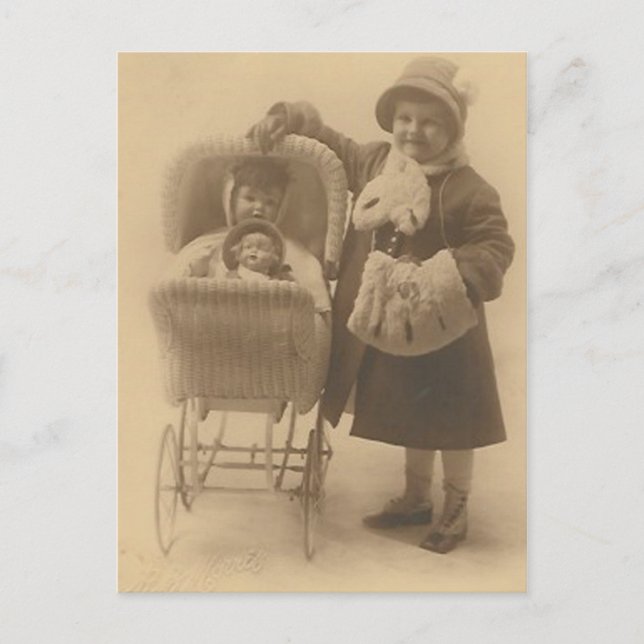 girl and her doll in carriage post card (Front)